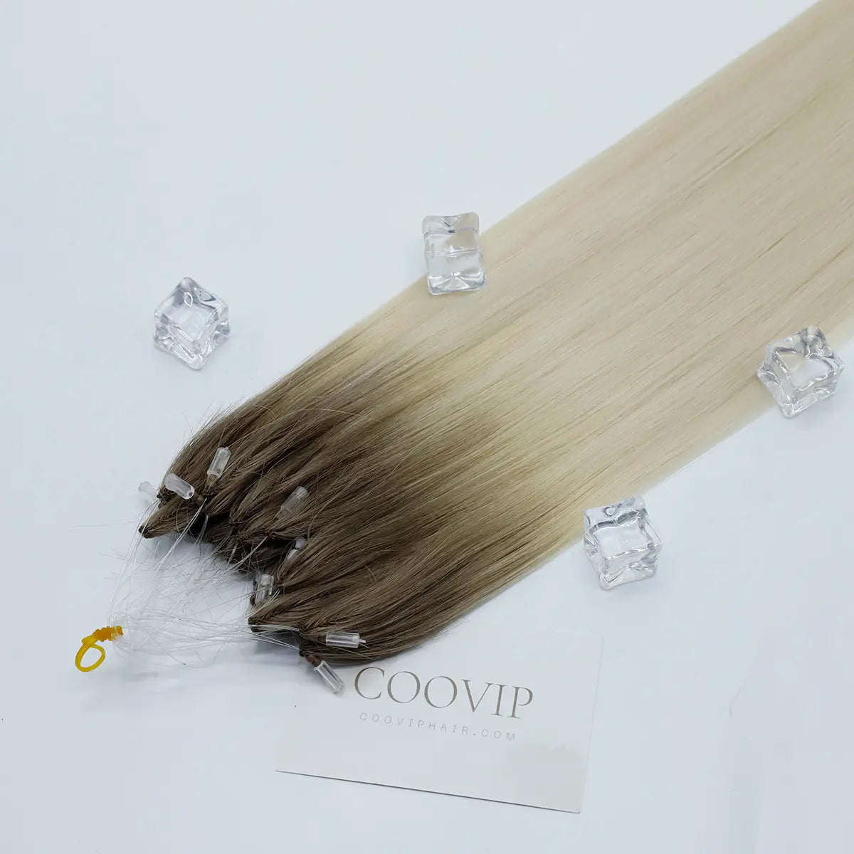 Stylist installing COOVIP HAIR H6 feather extensions

